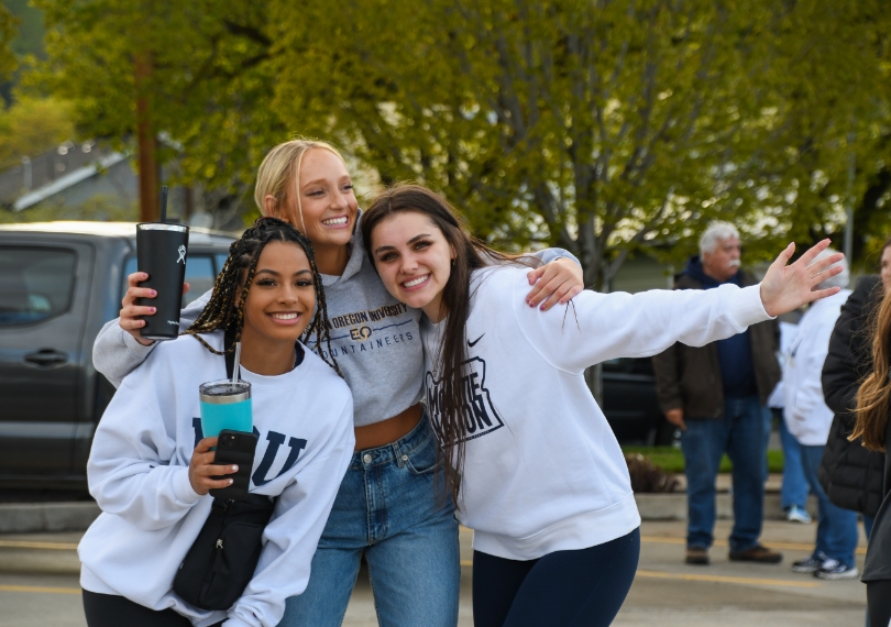 three EOU students smiling